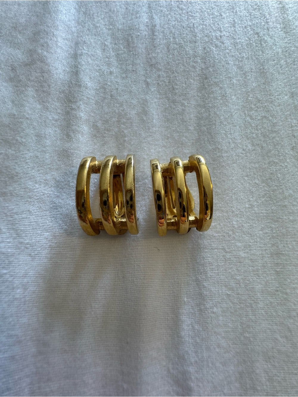 Authentic vintage Givenchy gold tone clip on earrings